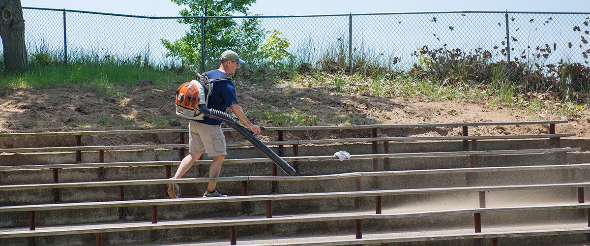 Blowing Sand off Bleachers