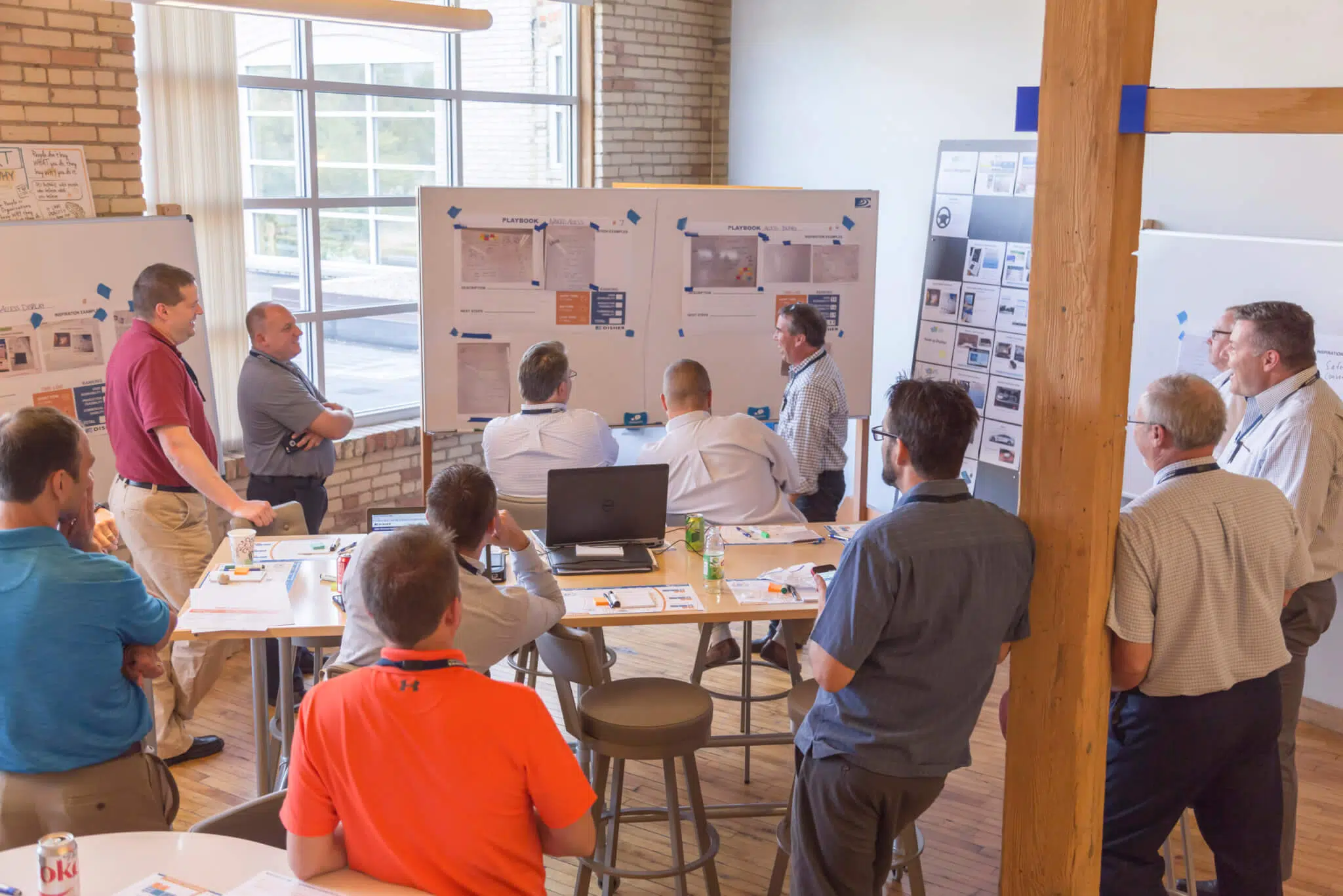 A group of people looking at ideas on a whiteboard
