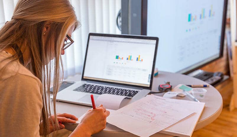 Women doing market research on her computerf