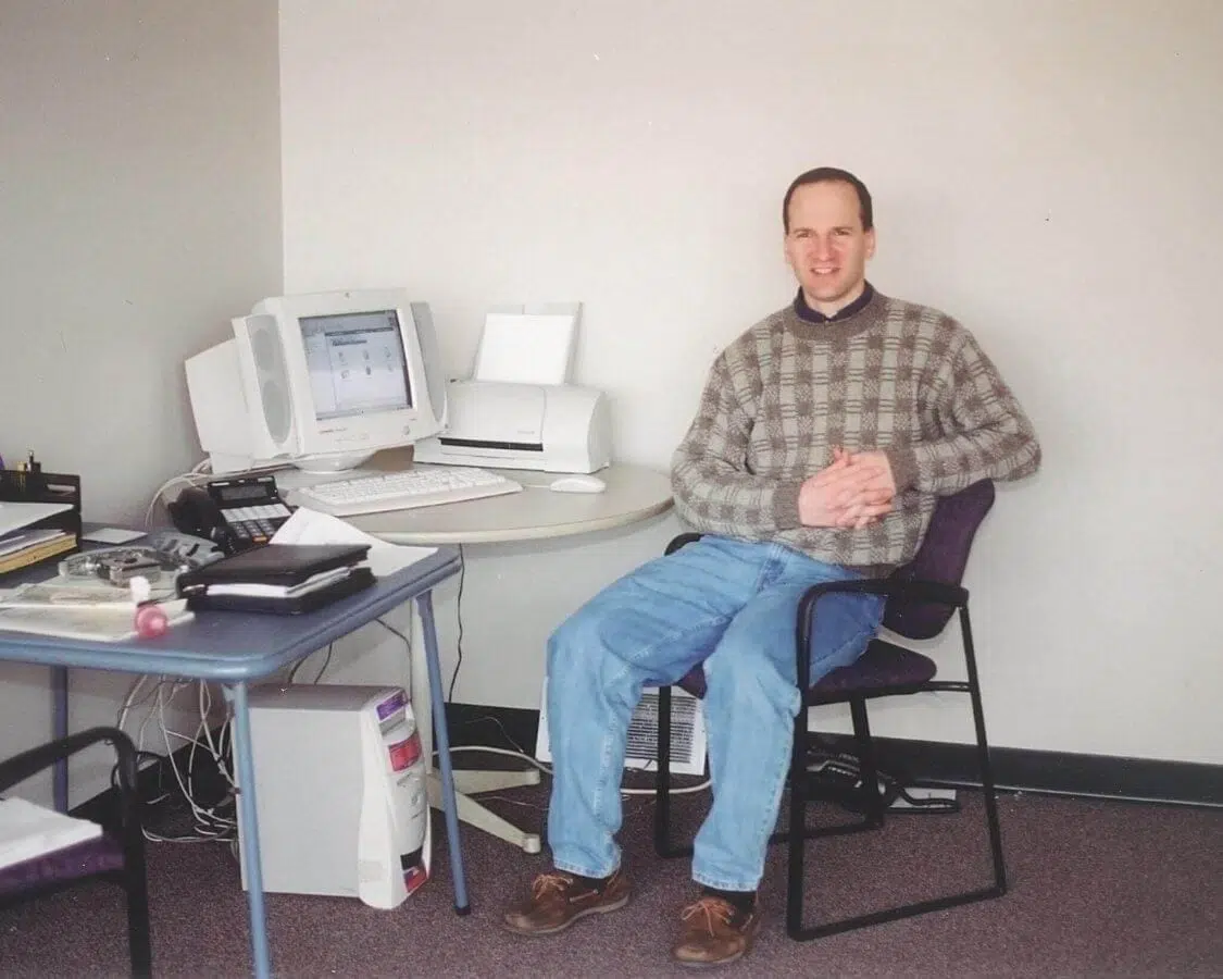 Jeff Disher sitting at a desk on his first day of work