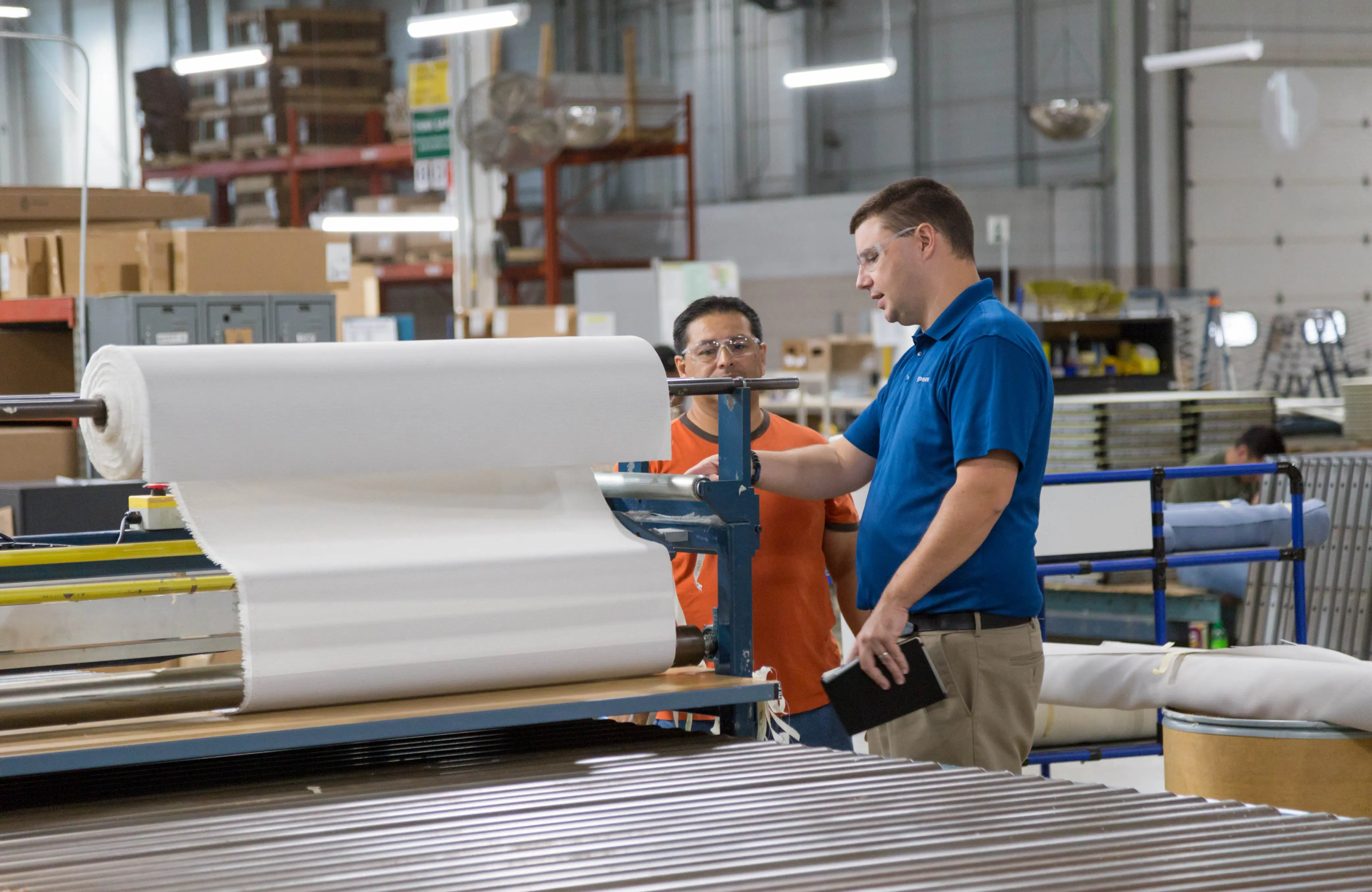 Engineer takes to Employee in Manufacturing Plant