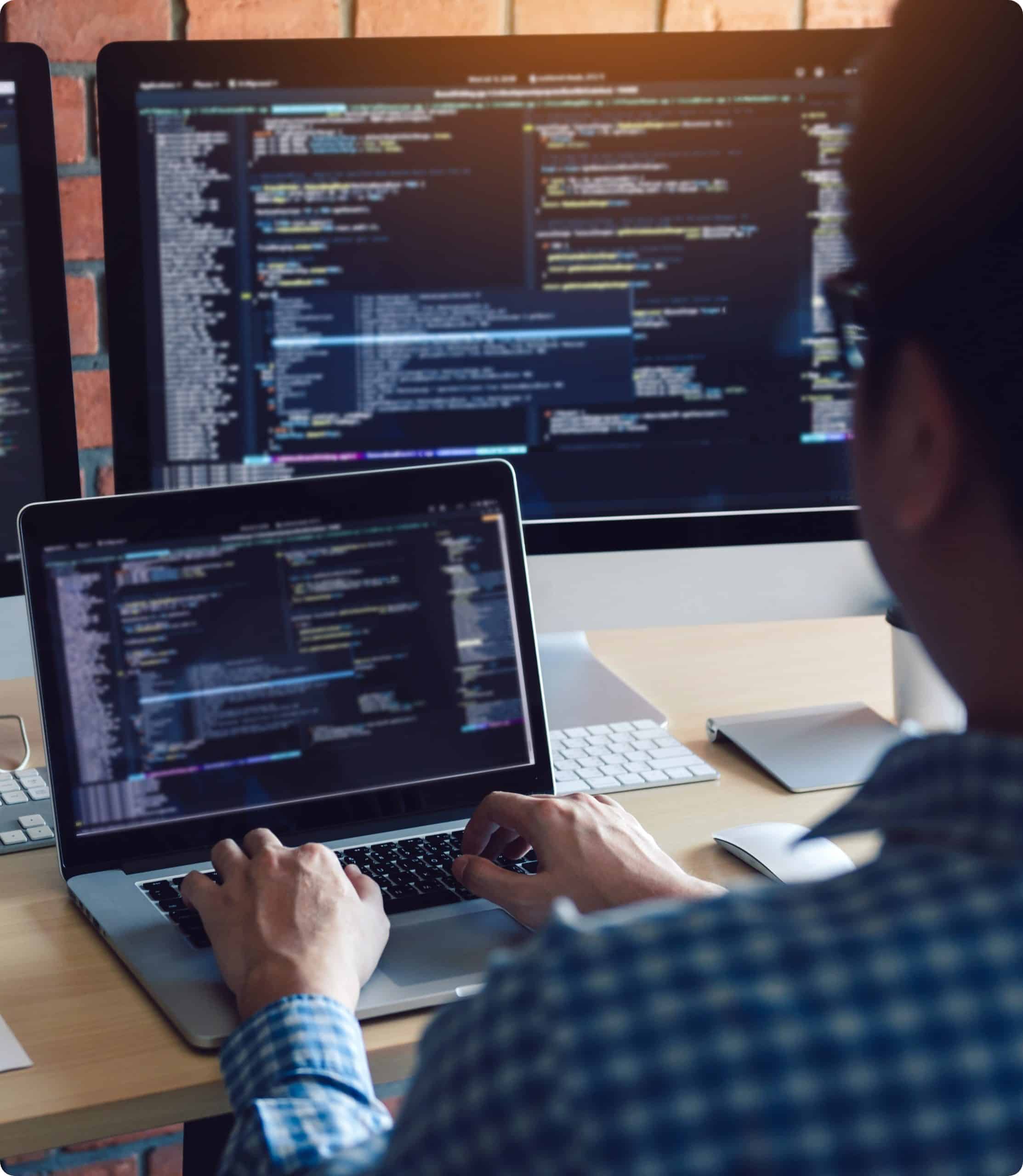 A man working on software development on his computer