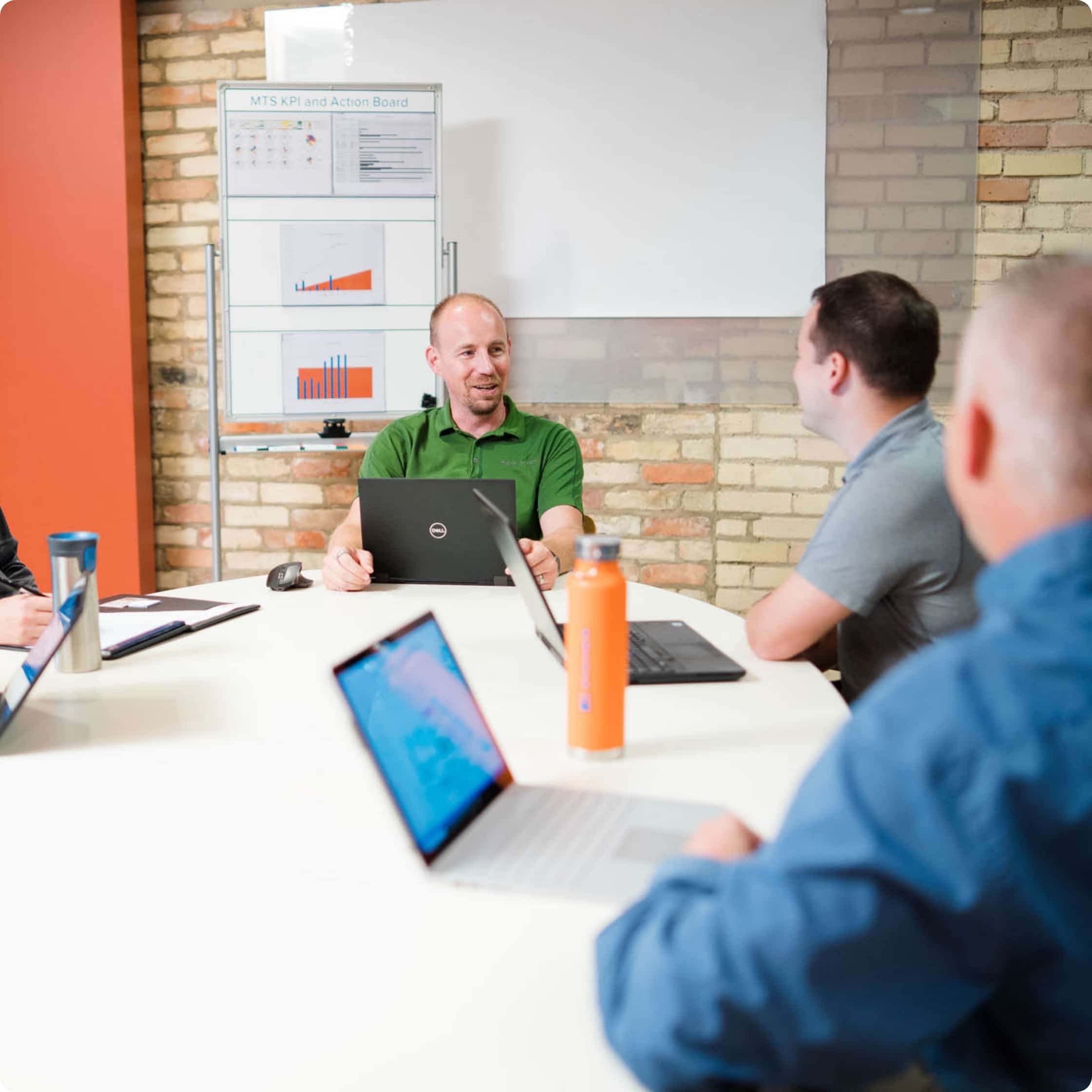 A group of people in a meeting