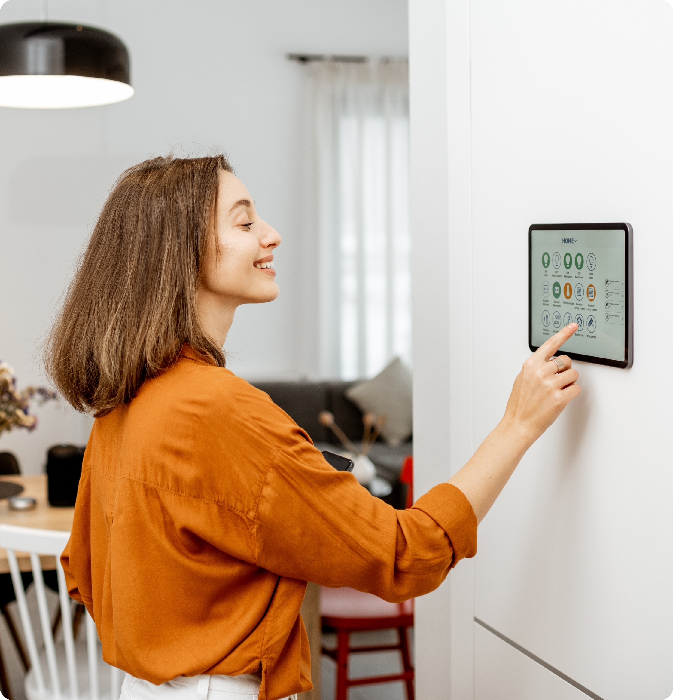 Women smiling while using a digital tablet in her home