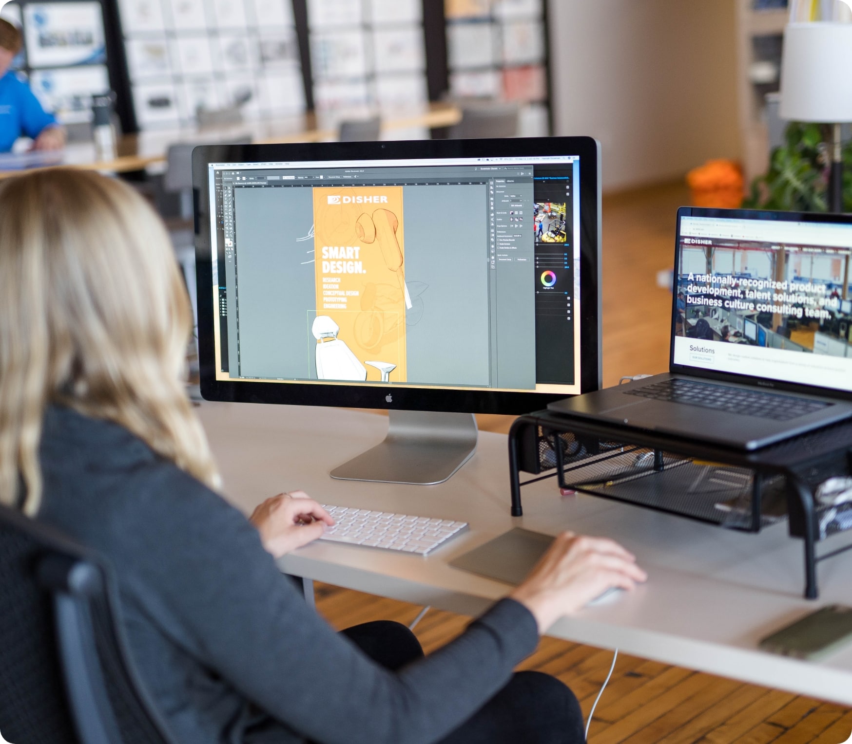 A graphic designer working on her computer
