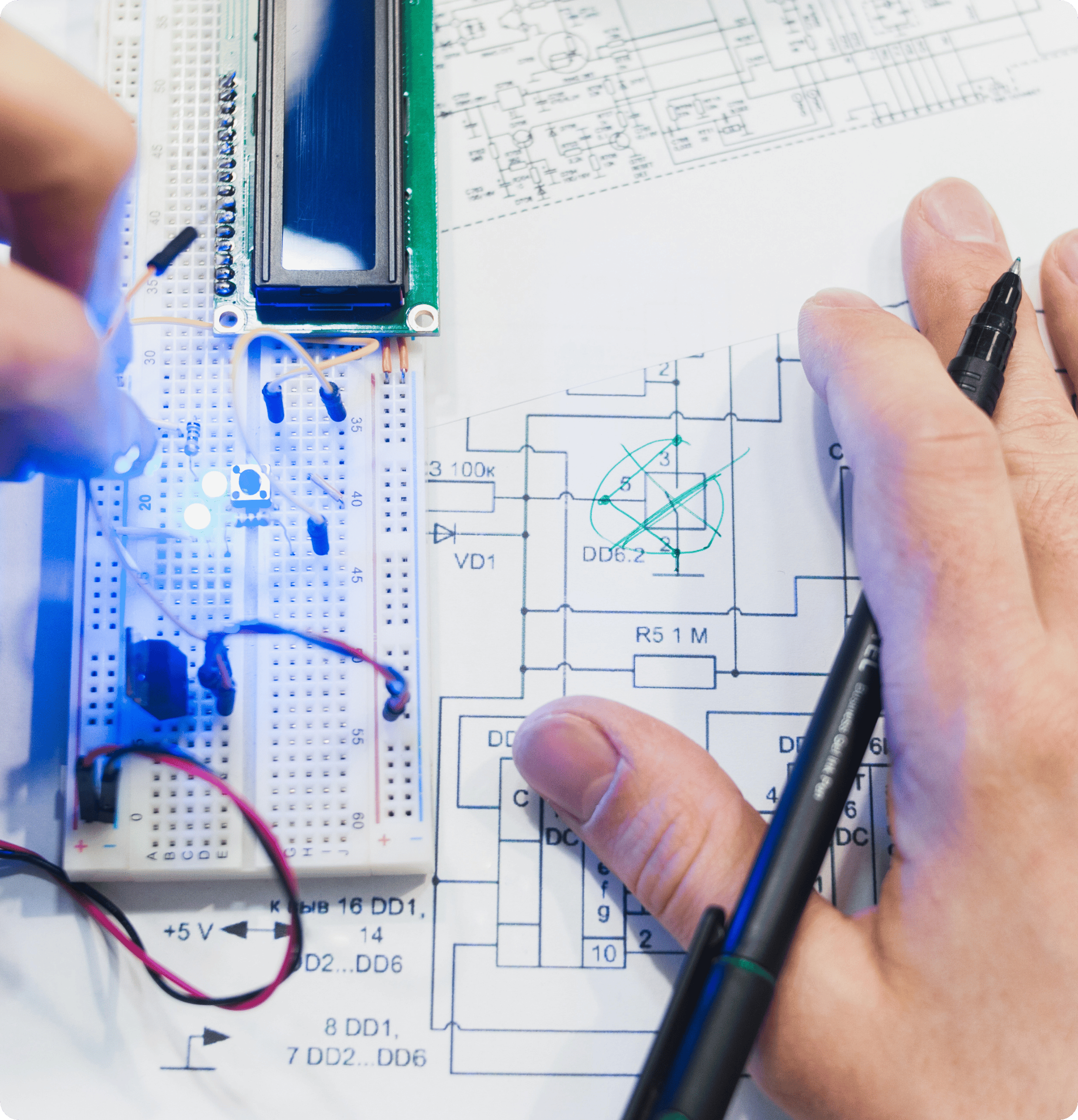 A overhead shot of an engineering working on electronics systems design