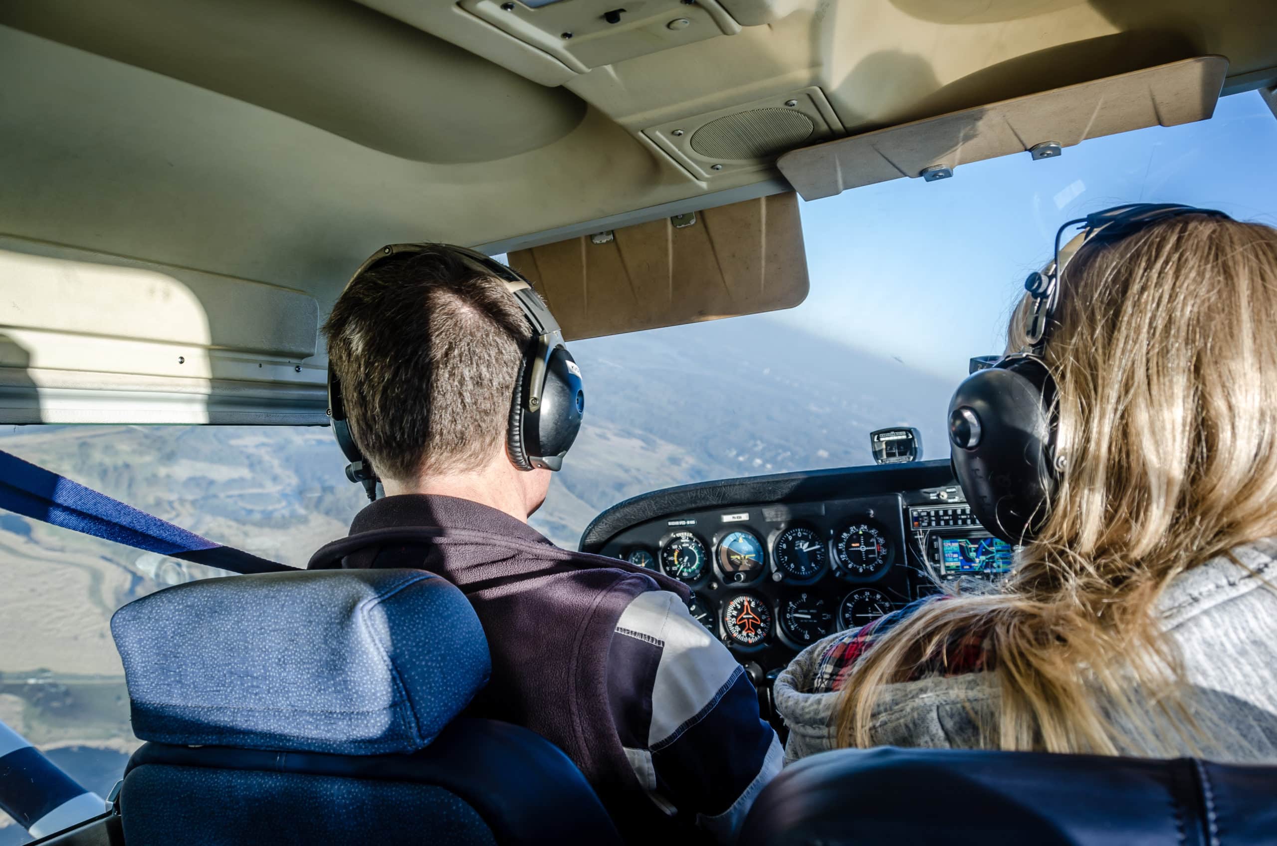 Two people flying a plane