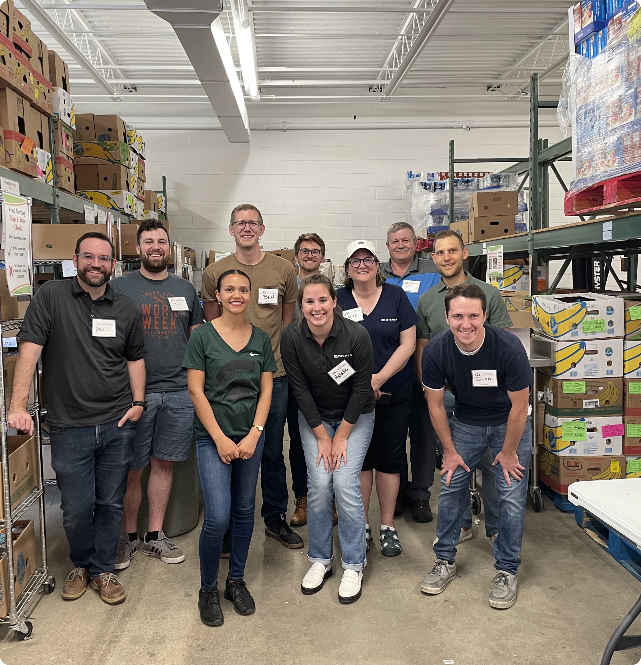 A group of DISHER employees volunteering at Community Action House