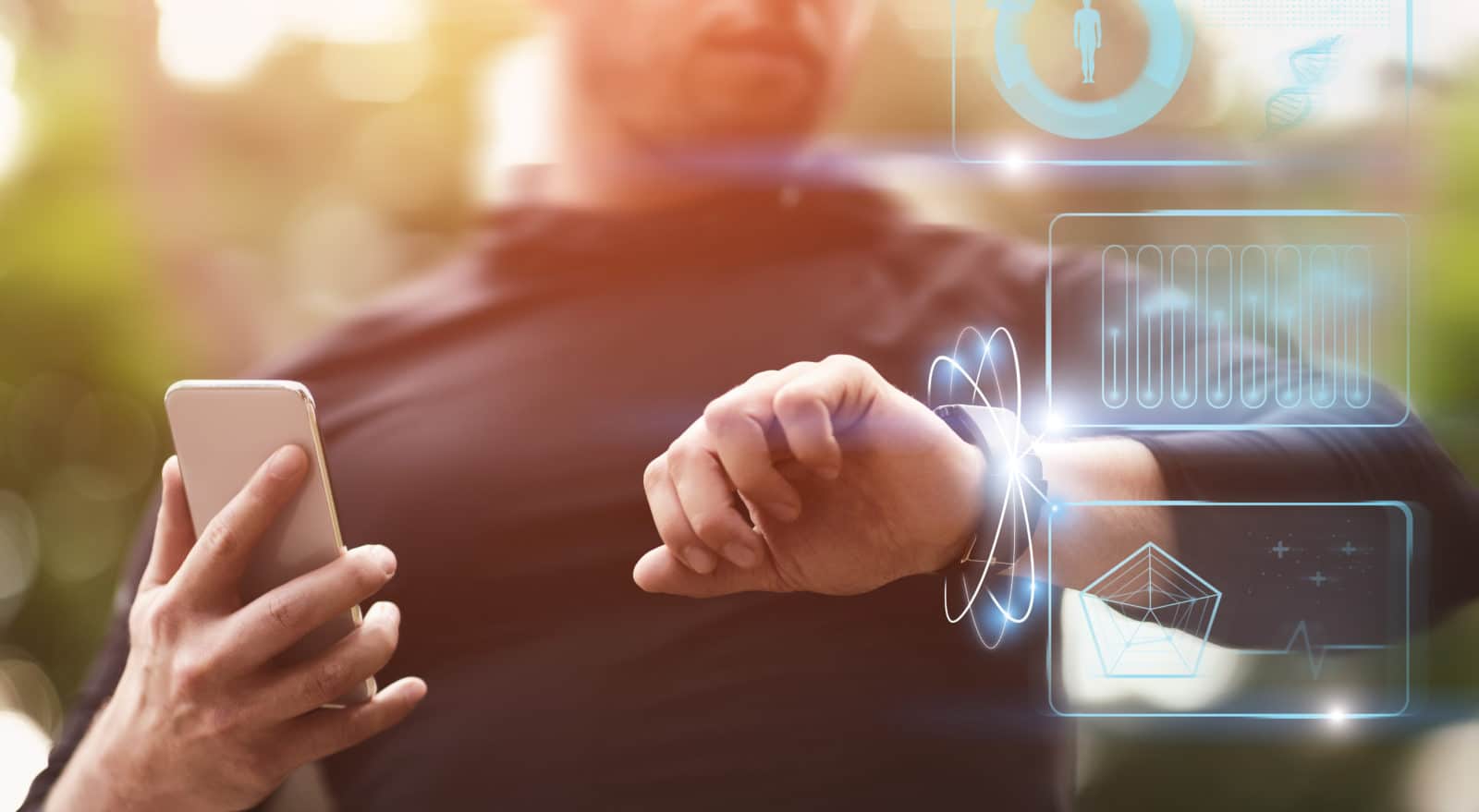 Modern Technology Concept. Guy holding smart phone checking wristband outdoors, panorama, HUD futuristic elements interface