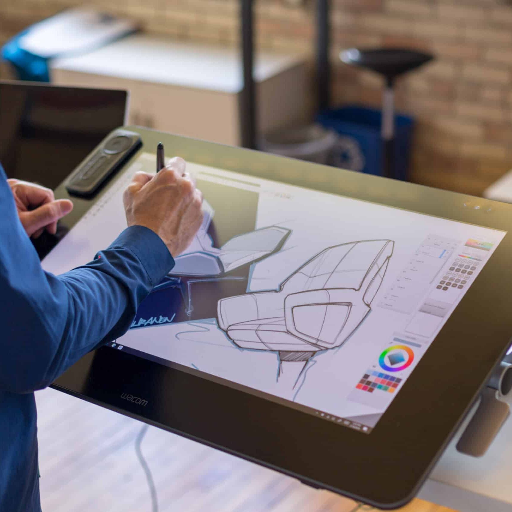 Industrial Designer sketching on a digital tablet