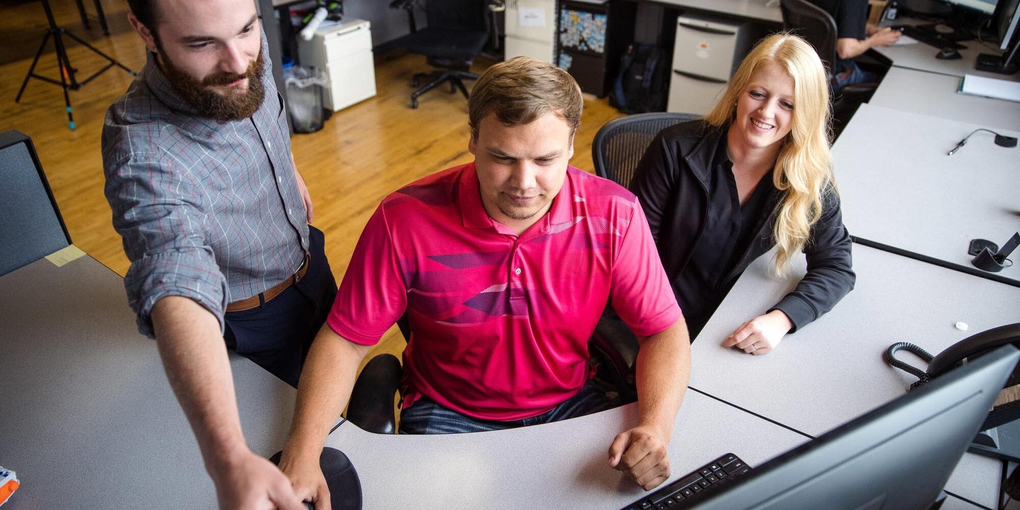 Engineers Looking at a Computer